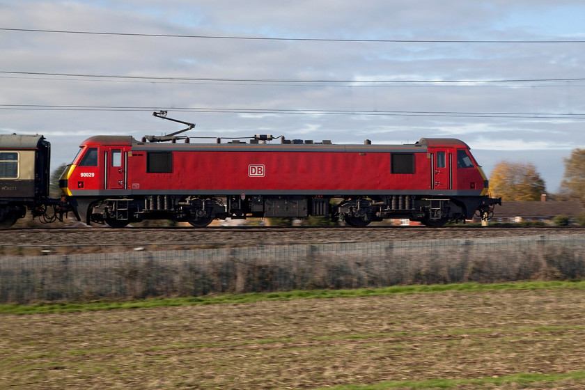 90029, outward leg of The Blackpool Illuminations-Pride of the North! 09.00 London Euston-Blackpool North (1Z78), Milton Malsor SP740557 
 90029, resplendent in its red DB livery, leads the 'The Blackpool Illuminations-Pride of the North!' excursion that left Euston at a sensible 09.00. It was leading a uniform set of Mk.1 stock that looked lovely and gained the attention of a couple of nearby dog walkers. The excursion, running as 1Z78, is seen passing Milton Malsor at 62 miles from London on the Northampton Loop. 
 Keywords: 90029 outward leg of The Blackpool Illuminations-Pride of the North! 0900 London Euston-Blackpool North 1Z78 Milton Malsor SP740557