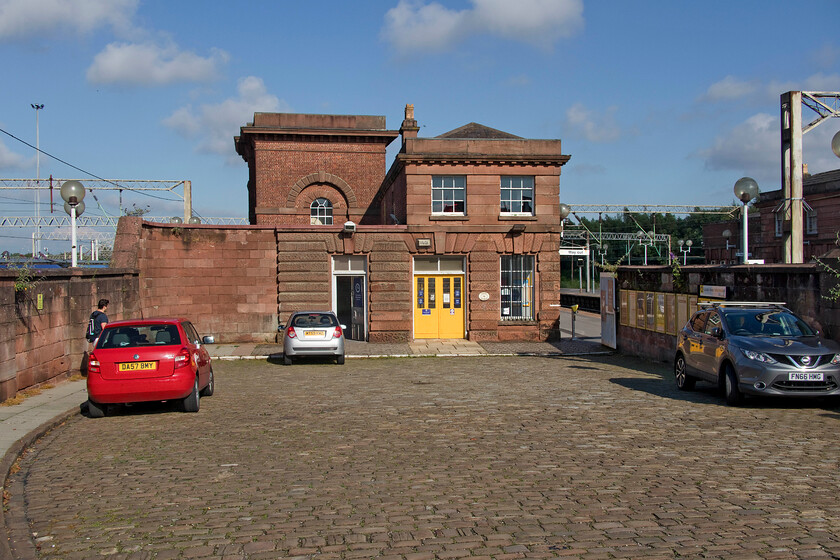 Frontage, Edge Hill station 
 The present-day frontage of the historically important Edge Hill station is seen from the cobbled entrance road off Tunnel Road. Edge Hill is Liverpool's oldest working station but this significance is not reflected in its condition with overgrown platforms, a pedestrian tunnel wreaking of urine and some rather run-down buildings far too big for its modern needs. That said, it cannot be denied that the 1836 built station is a grand structure that when it opened contained a stationary steam engine that provided power to haul trains up from Lime Street station by rope. 
 Keywords: Frontage Edge Hill station