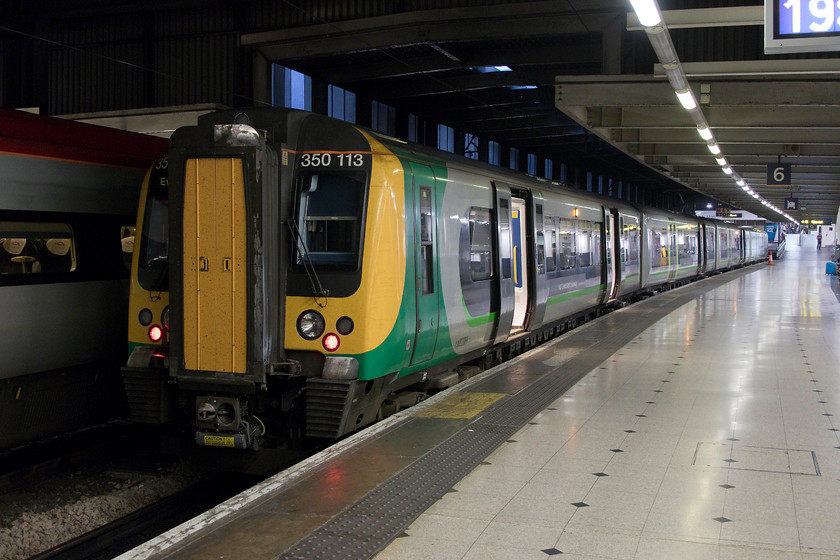 350113, LN 19.49 London Euston-Birmingham New Street (1Y79, RT), London Euston station 
 Our train home sits at platform six, 350113 waits to leave with the 19.49 to Birmingham New Street that my family would take as far as Northampton. On this particular night, this train was not over-crowed with only a few unfortunate passengers being forced to stand. On other nights, this service has been packed even with first class being de-classified. 
 Keywords: 350113 1Y79 London Euston station