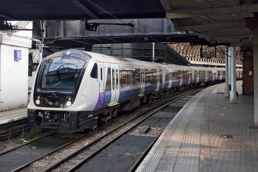 345006, XR 14.16 London Paddington-Reading (9R74, 2E), London Paddington station 
 The so-called 'purple' trains started operation on 25.11.19 exclusively on the Paddington to Reading services. In a strange move, they are being operated by TfL (under the Elizabeth Line banner even though the actual route is over a year from opening) on behalf of Great Western Railway. At the moment they are operating on the stopping services on a regular basis and provide an interesting alternative to all things green! I think that this slightly odd arrangement is to get the sets actually operating and earning their keep as they have been delivered and stored for many months now due to the huge delay to the Crossrail line. 345006 waits to leave Paddington with the 14.16 all stopper to Reading. The well-known blogger, Geoff Marshall, was one of the first to travel on a service and gave a good account of the new trains, see.... https://www.youtube.com/watch?v=SXV95PR7pEc 
 Keywords: 345006 14.16 London Paddington-Reading 9R74 London Paddington station Purple Train TfL