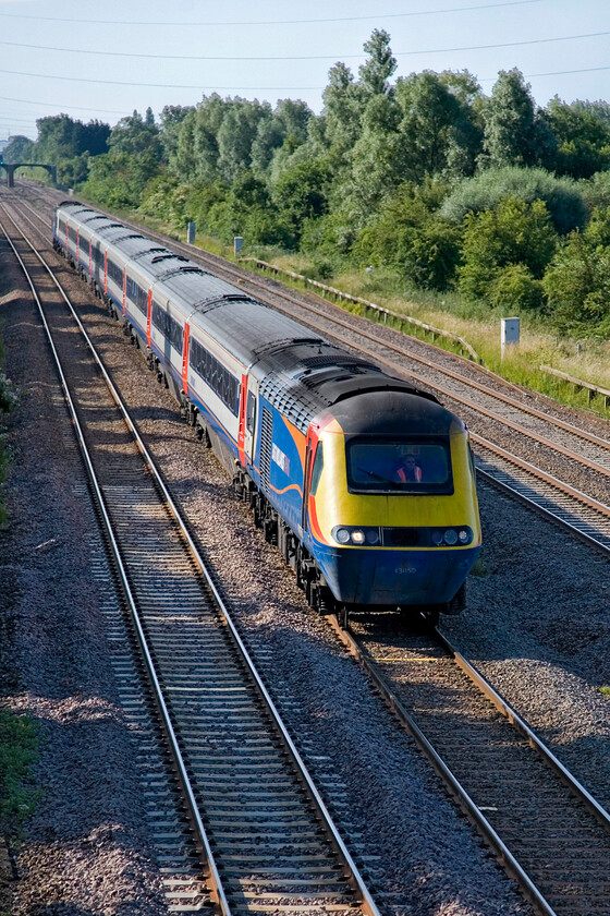 43050, outward leg of the Mallard 75-125 Special, 07.38 London St. Pancras-York (1Z43, 5E), Lower Farm Road, Bromham TL028518 
 The use of scratch-set HST for a charter should have been relatively easy for EMT to organise with it being a Saturday morning. Unusually running on the down slow line, 43050 leads the Mallard 75 125 Special past Bromham in Bedfordshire. The charter left St. Pancras at 07.38 heading for York where visitors would enjoy a visit to the NRM with special events around A4 4468 'Mallard' celebrating the seventy-fifth anniversary of its speed record. 
 Keywords: 43050 Mallard 75-125 Special, 07.38 London St. Pancras-York 1Z43 Lower Farm Road, Bromham TL028518