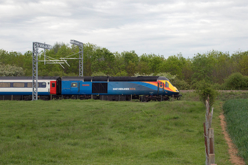 43480, EM 18.37 Corby-London St. Pancras (1P41, 10L), Irchester SP926665 
 Whilst I was walking back to the car at Irchester, the 18.37 Corby to St. Pancras HST passed heading south. I managed a side-on photograph teetering on top of a style! Former Grand Central power car 43480 'West Hampstead PSB' leads the train looking very smart in its revised East Midlands livery. If I was taking an evening train from Corby to London, this would be the service that I would choose over a class 222 Meridian every time! 
 Keywords: 43480 18.37 Corby-London St. Pancras 1P41 Irchester SP926665