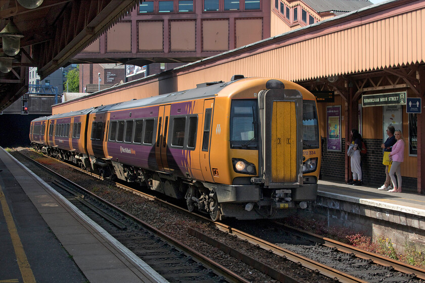 172334, LN 14.28 Birmingham Moore Street-Stratford-on-Avon (Cancelled from Kidderminster) (1S48, RT), Birmingham Moore Street station 
 172334 emerges into the warm late afternoon sunshine from the gloom of the reopened (from 1987) six hundred and thirty-five yards long Snow Hill tunnel. The West Midlands Railway unit is working an empty coaching stock train from Kidderminster as 1S48. It will soon depart from Moore Street as the 14.28 service to Stradford-on-Avon. The reasons for this unusual move was chaos in the Kidderminster/Droitwich area caused by some sort of signalling issue with Andy and I heading straight into it! 
 Keywords: 172334 14.28 Birmingham Moore Street-Stratford-on-Avon Cancelled from Kidderminster 1S48 Birmingham Moore Street station