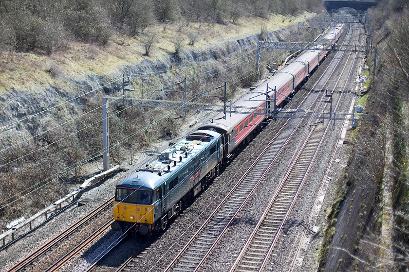 86101, 11.19 London Euston-Liverpool Lime Street footex (1Z85), Roade Cutting 
 A rare mainline outing for GBRF's 86101 'Sir William A Stanier FRS'. It is seen carrying Spurs supporters from London to Merseyside as the 11.19 Euston to Lime Street. A pretty evenly matched game ensued at Anfield with Coutinho putting Liverpool in the lead at the start of the second half with Kane equalising a short time later. The train is seen passing through Roade Cutting composed of ex. Virgin West Coast Mk. II stock. 
 Keywords: 86101 11.19 London Euston-Liverpool Lime Street footex 1Z85 Roade Cutting