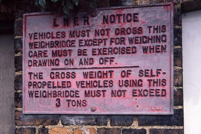 Former LNER cast sign, weighbridge, Helpringham 
 A remarkable survivor discovered on the former weighbridge adjacent to the closed station at Helpringham. The former LNER cast sign still wears some of its original red paintwork. As with all old artefacts that I have photgraphed, I wonder if it still survives today? 
 Keywords: Former LNER cast sign weighbridge Helpringham