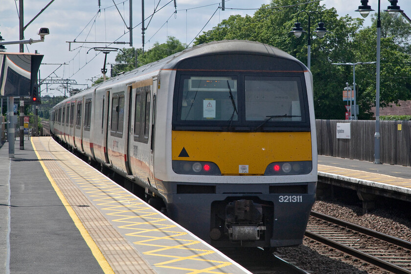 321311, LE 13.05 Clacton-on-Sea-London Liverpool Street (1N39, 1E), Ingatestone station 
 The 13.05 Clacton-on-Sea to Liverpool Street Greater Anglia service departs from Ingatestone station take, rather unfortunately, into the strong afternoon sunshine. Whilst I cannot make out every word on the piece of A4 taped to the second man's window of the cab, the words towards the bottom read 'This label must only be removed by engineering colleagues'. Despite making out these words I am none the wiser as to what it is all about! 
 Keywords: 321311 E 13.05 Clacton-on-Sea-London Liverpool Street 1N39 Ingatestone station Greater Anglia Dusty Bin