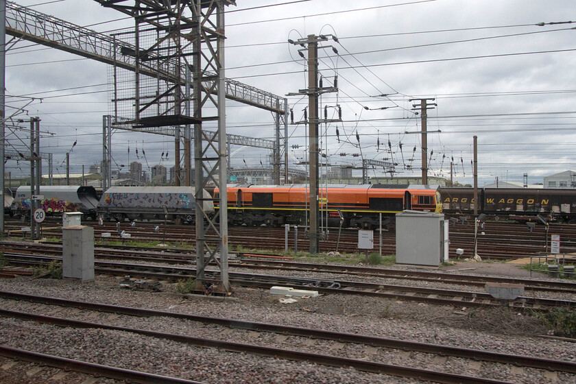 59204, stabled, Wembley Yard 
 59204 is seen stabled in Wembley Yard as we pass at speed on a Desiro heading north. I suspect that the Class 59 interloper would be leading an afternoon empty stone working back to the West Country, probably to Merehead Quarry 
 Keywords: 59204 stabled Wembley Yard