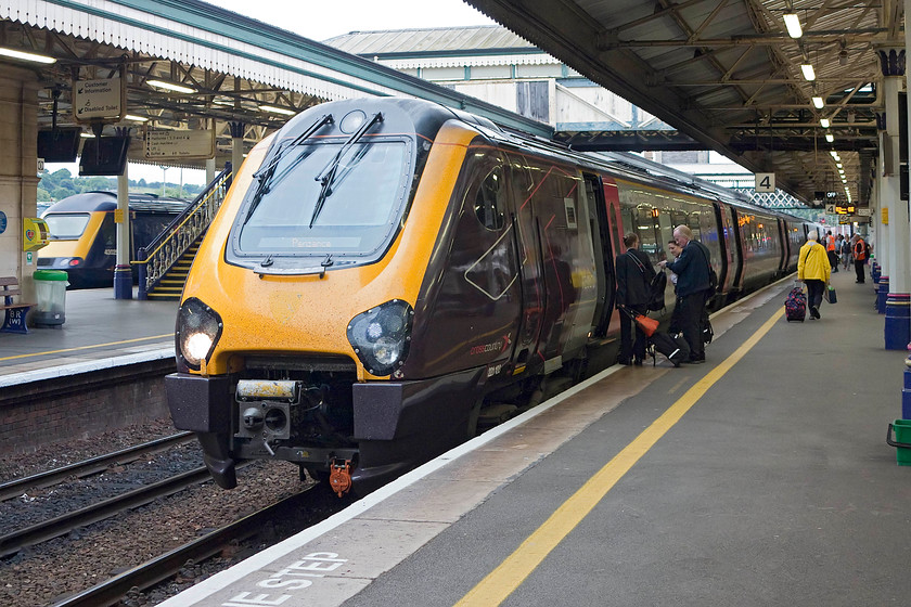 221133, XC 11.00 Glasgow Central-Penzance (1V62, 3E), Exeter St. David's station 
 A crew change takes place at Exeter St. David's station as the 11.00 Glasgow Central to Penzance pauses its journey. As usual with most Voyager workings, 221133 was well loaded to the point of looking uncomfortable. I find these units horribly cramped at the best of times and the thought of being forced to make a long journey on one fills me with dread! 
 Keywords: 221133 1V62 Exeter St. Davids station