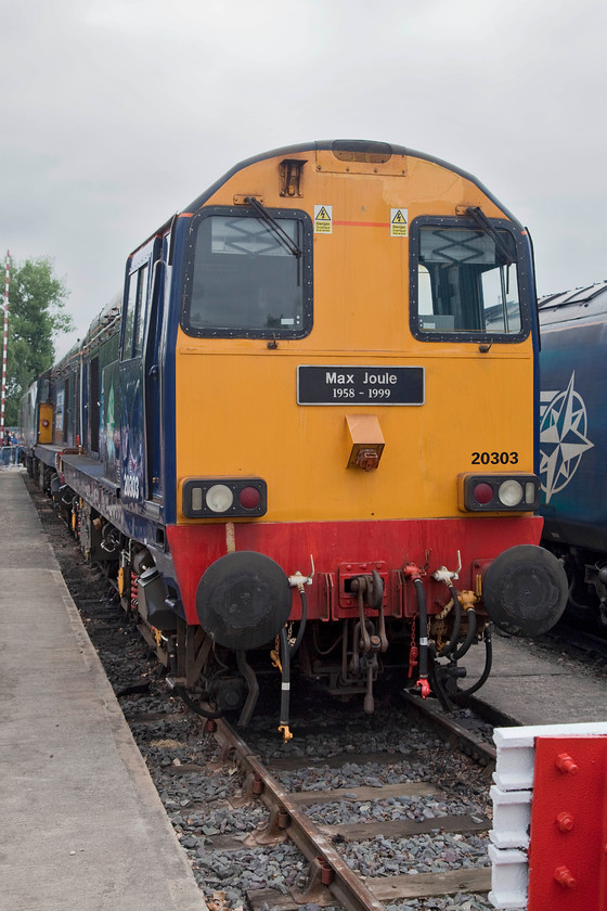 20303, on-display, DRS Open Day, Gresty Bridge 
 Class 20s were built with a 1000hp English Electric SVT engine; a tried and tested power uint. They were constructed between 1957 and 1968 and become totally dependable locomotives that gave, and still are, great service. So much so that at the time of writing some 23 examples are still mainline registered and earning a keep! Here, DRS owned 20303 'Max Joule 1958-1999' stands on-display at Gresty Bridge. 
 Keywords: 20303 DRS Open Day Gresty Bridge