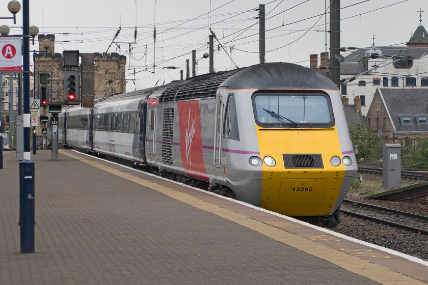 43295, VTEC 13.30 Edinburgh Waverley-London King`s Cross (via Leeds) (1E17), Newcastle station 
 Our train back to Peterborough arrives at Newcastle station. The 13.30 Edinburgh to King's Cross hst was running through to London, unlike electric services that were terminating at York due to engineering works between Colton Junction and Doncaster. The HST was able to travel under diesel power on the unelectrified track from Colton Junction to Leeds and then back to the ECML at Doncaster. The set is being led by power car 43295 that was originally numbered 43095 that has always been an Eastern Region power car released as part of set 254020. 
 Keywords: 43295 13.30 Edinburgh Waverley-London King`s Cross via Leeds 1E17 Newcastle station