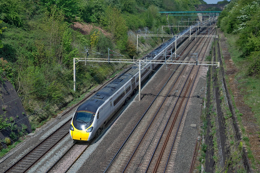 390153, VT 10.45 Wolverhampton-London Euston (1B12, 5E), Roade cutting 
 390153 working the 10.45 Wolverhampton to Euston passes through Roade cutting on a glorious spring morning. However, the sun is far too head-on at this time of day but with the COVID-19 restrictions preventing me from going to a better location this will have to do! 
 Keywords: 390153 10.45 Wolverhampton-London Euston 1B12 Roade cutting Avanto West Coast pendolino