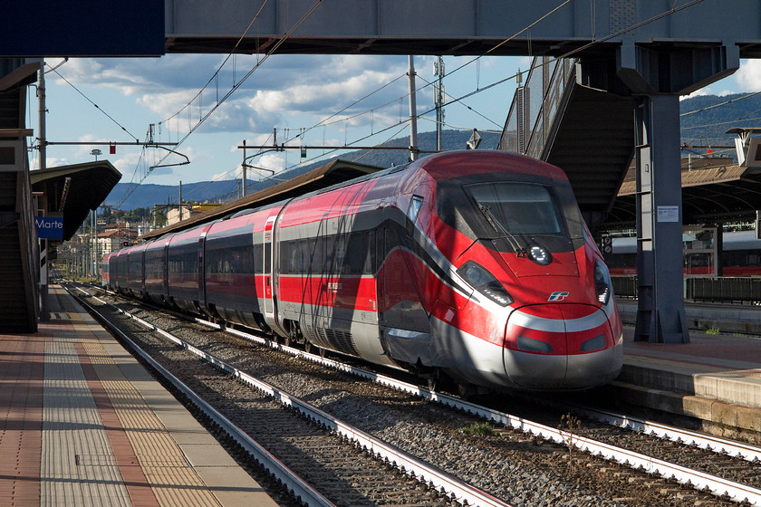 1000.045, unidentified working, Florence CM station 
 Launched with much fanfare in 2015, these elegant and stylish Frecciarossa 1000 high speed trains are moving rail travel to the next level on the Italian network. Here, an unidentified working formed of 1000.045 passes through Florence CM station. 
 Keywords: 1000.045 unidentified working Florence CM station