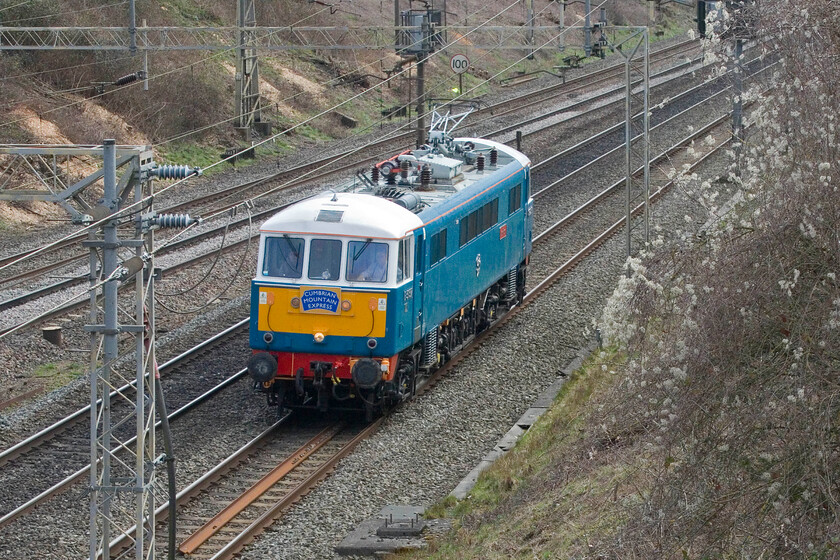 86259, 11.58 London Euston-Rugby CS (0Z89, 63E), Victoria bridge 
 With some extensive tree and vegetation clearance at Victoria bridge between Roade and Ashton I have been able to exploit some new photographic positions. 86259 Les Ross/Peter Pan is seen nicely positioned between some electrification masts heading north with the 0Z89 11.58 Euston to Rugby light engine move. The Class 86 lives in the carriage sidings just north of the station in between railtour duties. 
 Keywords: 86259 11.58 London Euston-Rugby Carriage sidings 0Z89,Victoria bridge AC electric AL6 Les Ross Peter Pan