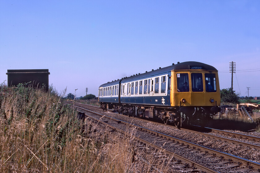 Class 114 DMU, 12.38 Doncaster-Ely, Black Bank 
 The 14.32 Norwich to Cambridge DMU service passes Black Bank on the approach to Ely North Junction. The train is composed of a lightweight two-car class 108 set that was initially allocated to Cambridge and later to Norwich. They operated widely throughout East Anglia and wider afield in some cases. 
 Keywords: Class 114 DMU 12.38 Doncaster-Ely Black Bank