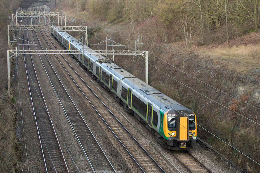 350110 & 350107, LN 10.33 Birmingham New Street-London Euston (1W10), Hyde Road bridge 
 350110 and 350107 is about to exit Roade Cutting under Hyde Road bridge forming the 10.33 Birmingham New Street to London Euston. Close examination of the cab window reveals a reflection of the bridge I'm standing on and even closer magnification using Photoshop reveals me standing taking the picture! 
 Keywords: 350110 350107 10.33 Birmingham New Street-London Euston 1W10 Hyde Road bridge