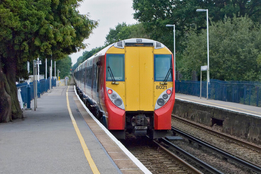 458021 & 458015, SW 14.20 London Waterloo-Reading (2C41), Sunningdale station 
 The 14.20 Waterloo to Reading 2C41 South West Trains service leaves Sunningdale station being worked by 458021 at the rear and 458015 leading at the front. Notice the large tree growing out of the platform that appears to be encroaching a little too much? 
 Keywords: 458021 458015 14.20 London Waterloo-Reading 2C41 Sunningdale station South West Trains