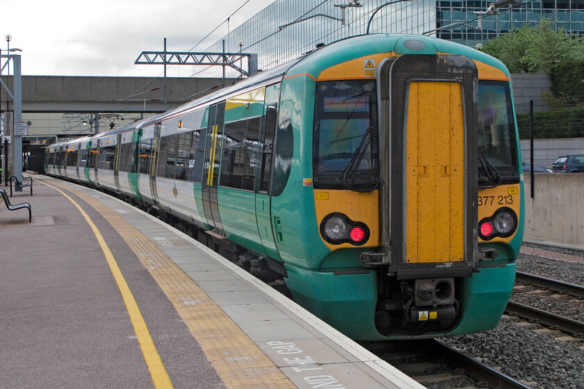 377213, SN 18.13 Milton Keynes Central-Clapham Junction, Milton Keynes Central station 
 Southern's 377213 has just arrived at Milton Keynes and will soon return to Clapham Junction as the 18.13 service. My wife, son and I joined this train and travelled south as far as Kensington Olympia. On arrival, we walked the relatively short distance up Kensington High Street to where we stayed on Church Street; very handy for our London activities. 
 Keywords: 377213 18.13 Milton Keynes Central-Clapham Junction Milton Keynes Central station Southern Electrostar