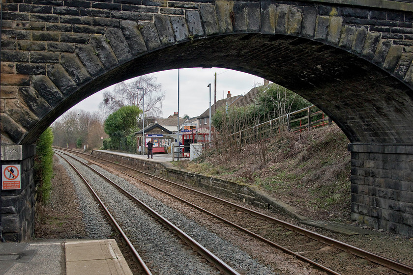 Andy, Shepley station 
 The split platform arrangement at Shepley station gave Andy and I an opportunity to photograph each other! So, here is Andy, taking a picture of me taking a picture of him! Shepley station was opened by the Lancashire and Yorkshire Railway in 1850. It used to be where the short branch from Clayton West, that was closed by BR in 1983, joined the mainline, if the Penistone line could ever be described as such!. 
 Keywords: Shepley station