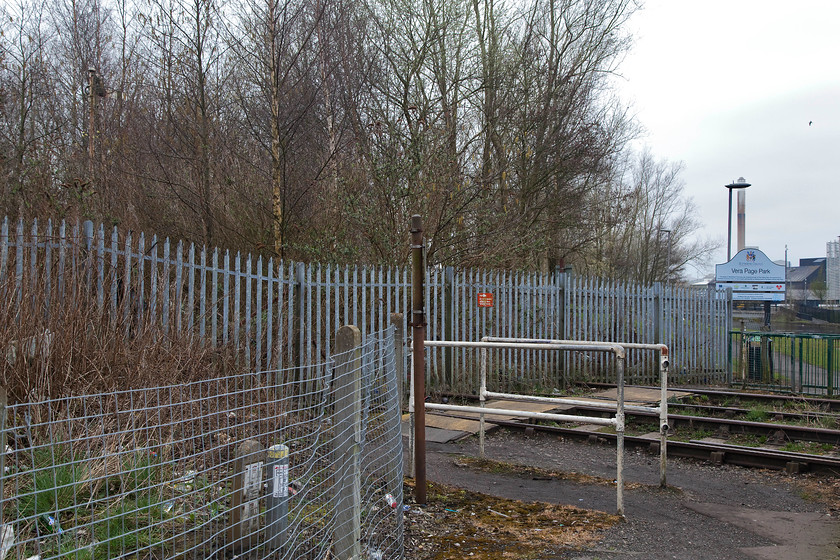 Foot crossing, former St Helens and Runcorn Gap Railway, St 
 The foot crossing over the route of the former St Helens and Runcorn Gap Railway that linked St. Helens to the Chat Moss line at Sutton Oak Junction. The entrance to Vera Page Park can be seen in the background as can the redundant signal post complete with home arm hidden in the trees on the left. 
 Keywords: Foot crossing St. Helens SJ515950