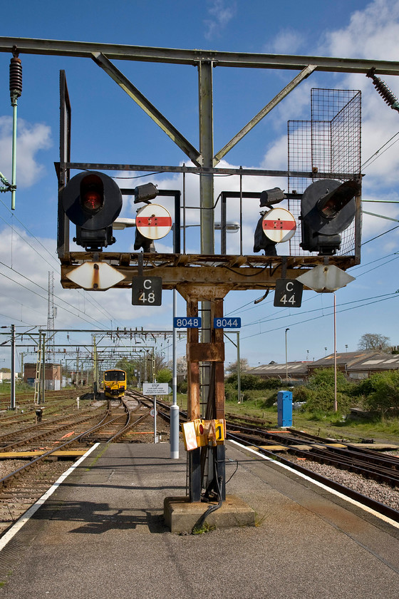 950001, testing all tracks & searchlight up starter gantry, Clacton-on-Sea station 
 A fine example of one of Clacton's 'searchlight' starter brackets that certainly look as if they have suffered from the ravages of the sea air! This unique signalling was installed in 1958 when the lines to the Essex coast were electrified. They are controlled by a mechanical/electro-mechanical lever frame with parts dating from 1891. There are plans to resignal the station and the line afoot but this is not scheduled to happen until 2020 so this vintage and unique signalling can be enjoyed for a few years yet. 
 Keywords: 950001 searchlight up starter gantry Clacton-on-Sea station Network Rail Track Recording unit Class 150