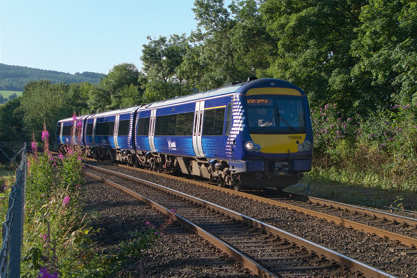 170434, SR 08.17 Dundee-Glasgow Queen Street (1T30), Barnhill NO124226 
 170434 takes the sharp reverse curve on the approach to Perth from the east at Barnhill. The 08.17 Dundee to Glasgow Queen Street will pass the signal box and take a sharp left curve to cross the River Tay over the twin single track viaducts. 
 Keywords: 170434 08.17 Dundee-Glasgow Queen Street 1T30 Barnhill NO124226 ScotRail Perth