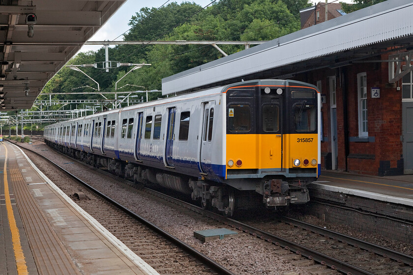 313857 & 313838, TFL 15.56 Shenfield-London Liverpool Street (2W03, RT), Brentwood station 
 TfL Rail retains a small number of these elderly Class 315 units that date from 1980/1. They are used on the Shenfield to Liverpool Street route during weekdays only and during peak times, not that this is an issue at the moment with the much-reduced passenger numbers. 315857 leads 315838 into Brentwood station working the 2W03 15.56 Shenfield to Liverpool Street service. 
 Keywords: 313857 313838 15.56 Shenfield-London Liverpool Street 2W03 Brentwood station TFL