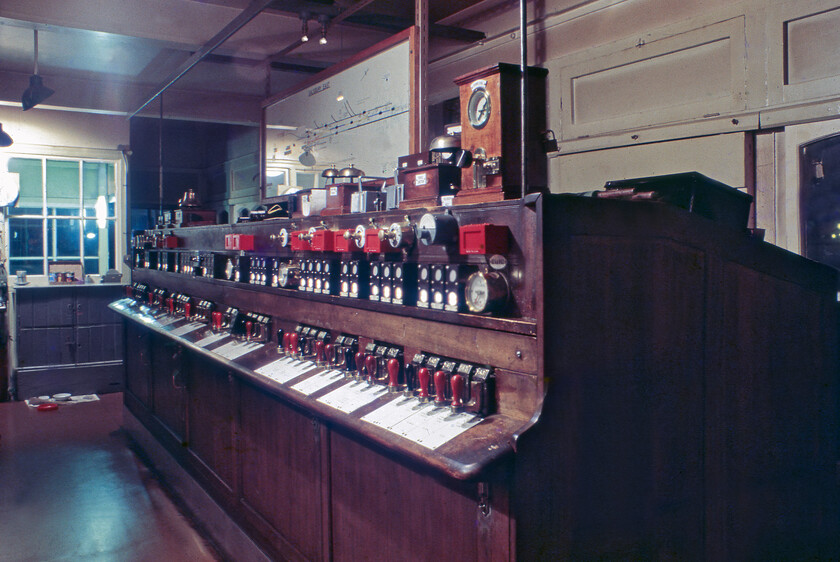 Interior of Salisbury East signal box 
 I managed to blag an 'access all areas' pass on my visit to Salisbury the previous weekend, see..... https://www.ontheupfast.com/p/21936chg/C385496854/x14-day-trip-to-salisbury-08-08-81 Things were very much the same on this evening visit with us being invited into both Salisbury East and West signal boxes. We were pleased to get access to these boxes as they are far from normal with them having no conventional levers but employing an electro-pneumatic system with sliding levers. The interior of the box is seen here still looking very smart and well-kept. Notice the cat feeding bowls on the shiny linoleum at the far end of the box. With just a week or so in operation, I hope that the feline occupant was appropriately re-homed when the box shut. 
 Keywords: Interior of Salisbury East signal box