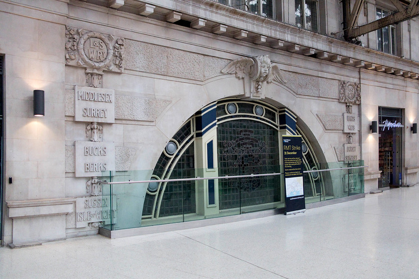 L&SWR stone carvings, London Waterloo station 
 Some of the ornate and beautiful stonework on the upper levels of Waterloo station. It has been sliced in half by the creation of the mezzanine level from where the picture was taken. This extra level was competed in July 2012 at a cost of 25 million. It is referred to as the 'retail balcony' even though the number of units is a fraction of what was envisaged! Notice the information poster in the middle of the picture giving customers information about yet another strike. 
 Keywords: L&SWR stone carvings London Waterloo station