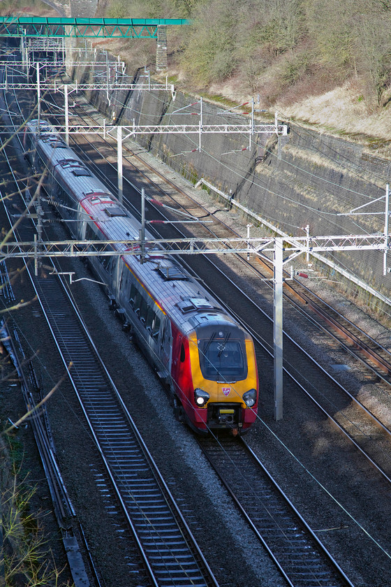 Class 221, VT 11.28 Chester-London Euston (1A19, 1E), Roade Cutting 
 An unidentified class 221 races through Roade Cutting heading south forming the 11.28 Chester to London Euston. I can think of more comfortable and better ways to make this journey rather than sitting in a cramped, plastic feeling and noisey Voyager. 
 Keywords: Class 221 1A19, Roade Cutting