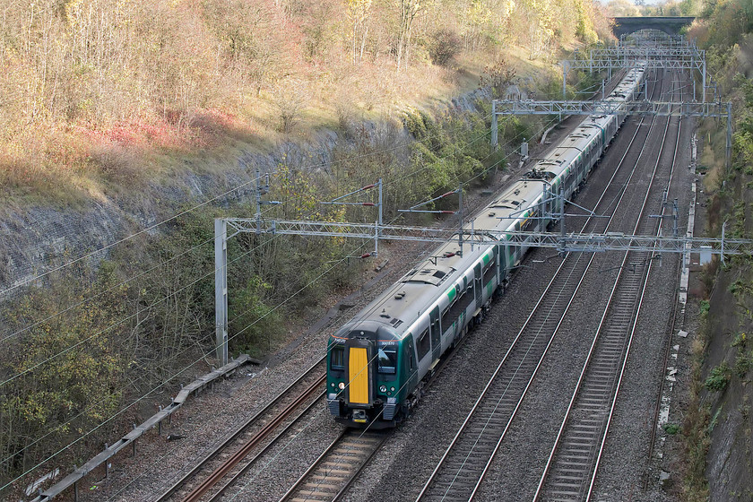 350370 & 350247, LN 13.34 London Euston-Birmingham New Street (2Y23, 7L), Roade Cutting 
 Even though there is very limited light in the depths of Roade Cutting, as can be seen, the sun was actually shining! In London Northwestern's awful new livery, 350370 leads 350247 forming the 13.34 Euston to Birmingham New Street. 
 Keywords: 350370 350247 13.34 London Euston-Birmingham New Street 2Y23 Roade Cutting