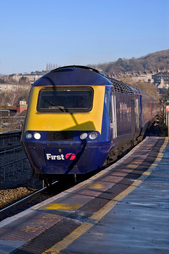 43018, GW 11.27 London Paddington-Penzance (1C82), Bath Spa station 
 A fine portrait photograph of 43018 as it approaches Bath Spa station leading the 11.27 Paddington to Penzance working diverted due to engineering workings on the Berks. and Hants. route. Whilst winter photography can be a tricky and, at some times, a miserable experience when the weather is like this it is an absolute joy with really strong light and with the sun's low angle, detail on the subject that is normally in shadow is picked out. 
 Keywords: 43018 11.27 London Paddington-Penzance 1C82 Bath Spa station First Great Western HST