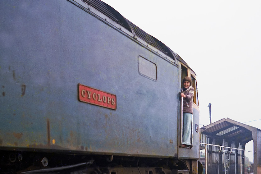 Jo, 47087, Westbury MPD 
 My friend, neighbour and spotting companion stands in the doorway of 47087 'Cyclops' at Westbury depot. For the first 25 years of its life, 47087 was a West Country engine moving between OOC, CF and BR depots. It then moved north and was re-numbered 47624 being re-named 'Saint Andrew'. It was stored and stripped in 1998 and eventually cut up at Booths in Rotherham in 2006.