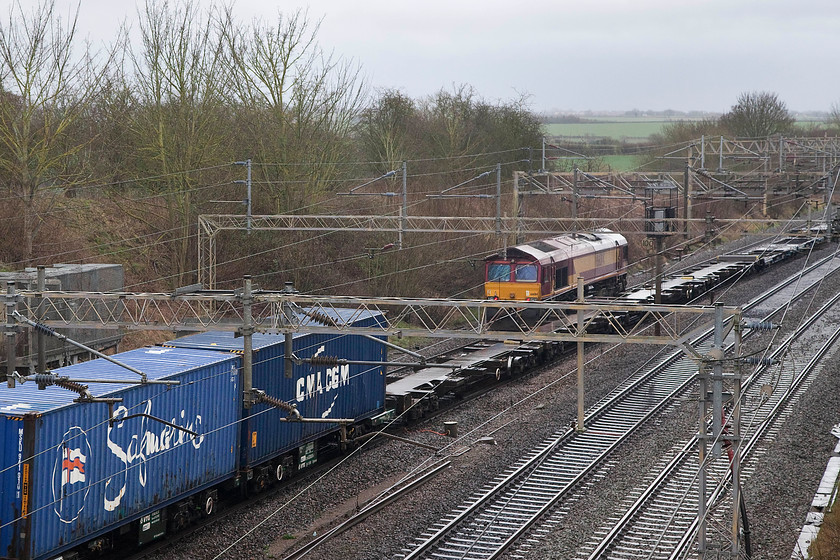 09.32 Felixstowe North-Crewe Basford Hall (4M88) & 66014, 14.47 Daventry Wembley LE, Victoria Bridge 
 It was lucky that the 4M88 09.32 Felixstowe to Crewe Freightliner heading north was lightly loaded as a gap in the boxes allowed a picture of 66014 heading south. 66014 was running light engine as the 14.47 Daventry International Railfreight Depot (DIRFT) to Wembley. 
 Keywords: 09.32 Felixstowe North-Crewe Basford Hall Freightliner 4M88 66014 14.47 Daventry Wembley Light engine Victoria Bridge