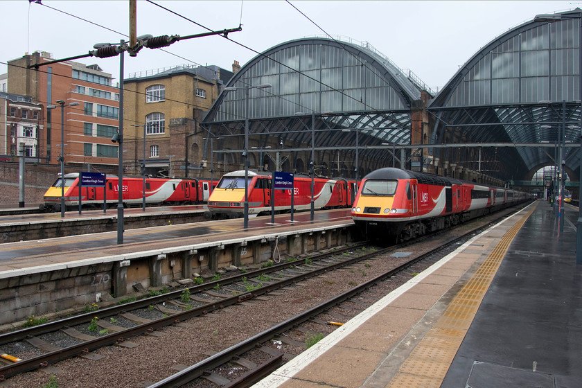 91129, GR 16.00 London King`s Cross-Edinburgh (1S24, 4L), 91106, GR 16.05 London King`s Cross-Leeds (1D21, RT) & 43302, GR 15.30 London King`s Cross-Edinburgh (1S23, 3L), London King`s Cross station 
 A familiar site at King's Cross station but one that is set to change within a month as the Azumas are scheduled to be introduced. To the left, 91129 waits at the head of the 16.00 to Edinburgh. In the centre is 91106 that will lead the 16.05 to Leeds whilst 43302 will work the 15.30 to Edinburgh. The future of all these train sets and their locomotives is unclear as the new order takes over. It is looking likely that at least some of the Mk. IVs and their class 91s will end up on the WCML being used by the open access operator Great North Western Railway. 
 Keywords: 91129 16.00 London King`s Cross-Edinburgh 1S24 91106 16.05 London King`s Cross-Leeds 1D21 43302 15.30 London King`s Cross-Edinburgh 1S23 London King`s Cross station