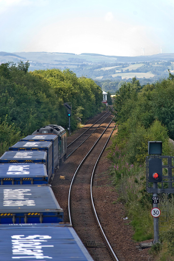 68001, 12.23 Grangemouth Tdg Sidings-Aberdeen Craiginches (4A13), Camelon station 
 68001 'Evolution' slows for Carmuirs East junction that it will take and turn north towards Stirling with the 12.23 Grangemouth to Aberdeen DRS intermodal working. The photograph is taken from Camelon station footbridge with Carmuirs East signal box just in view. 
 Keywords: 68001 12.23 Grangemouth Tdg Sidings-Aberdeen Craiginches 4A13 Camelon station DRS Intermodal Evolution