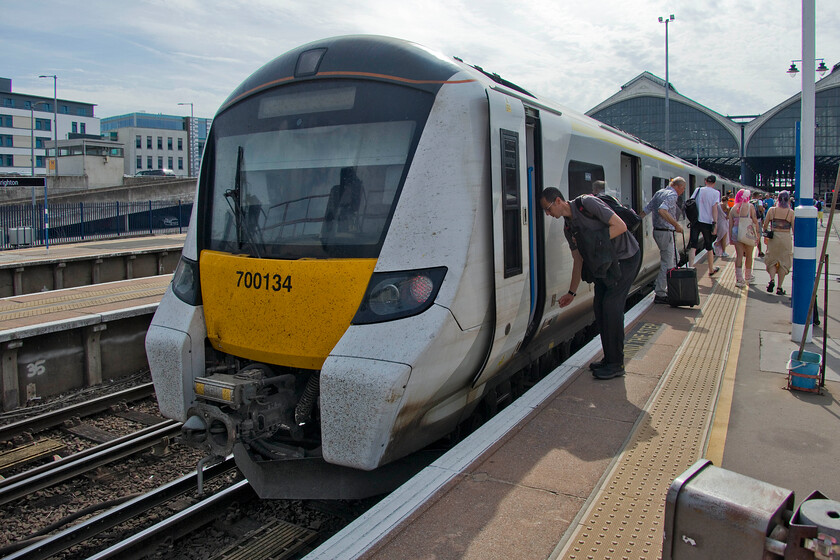 700134, TL 11.14 Brighton-Cambridge (9S24, 7L), Brighton station 
 The incoming Thameslink service arrived at Brighton late with the driver of the returning service ready and waiting on the platform end to head back straightaway. He is seen unlocking the driver's door ready to get the 11.15 service to Cambridge away promptly. My wife and I travelled aboard 700134 from here as far as London St. Pancras International. On this hot day that was now the fourth with a September temperature in excess of thirty degrees Celsius, my wife and I both commented that it was actually a bit chilly inside the train such was the efficiency of its air conditioning. 
 Keywords: 700134 11.14 Brighton-Cambridge 9S24 Brighton station Thameslink