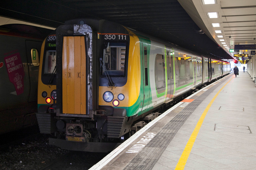 350111, LN 14.33 Birmingham New Street-London Euston (1W18, 1L), Birmingham New Street station 
 Our final train of our trip to Liverpool. 350111 sits in the gloom of New Street station. We took this, the 14.33 to London Euston,as far as Northampton where we arrived just one minute late. 
 Keywords: 350111 1W18 Birmingham New Street station