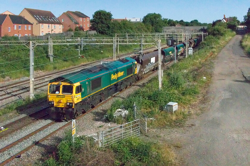 66572, 05.22 Crewe Basford Hall-Wolverton Centre Sidings (4G97, 4E), site of Roade station 
 An interesting little move that I had spotted on RTT was this, the 4G97 operated by Freightliner's 66572. It was the 05.22 Crewe Basford Hall to Wolverton Centre Sidings (for access to the works) that was conveying a short set of former Freightliner MGR wagons for overhaul and conversion. I believe that they are to be converted for aggregate use but I stand to be corrected. 
 Keywords: 66572 05.22 Crewe Basford Hall-Wolverton Centre Sidings 4G97 site of Roade station Freightliner