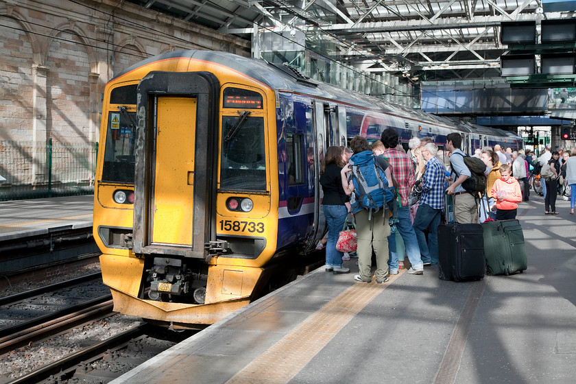 158733, SR 16.54 Edinburgh Waverley-Tweedbank (2T50), Edinburgh Waverley station 
 This image clearly shows the popularity of the Border's railway to Tweedbank. Trains are heavily loaded with two-car 158 units proving to be inadequate to handle the numbers. It's heartening to see a new railway such as this being so popular but I hope that it doe not become a victim of its own success. 158733 will soon be leaving Edinburgh with the 16.54 to Tweedbank. 
 Keywords: 158733 16.54 Edinburgh Waverley-Tweedbank 2T50 Edinburgh Waverley station