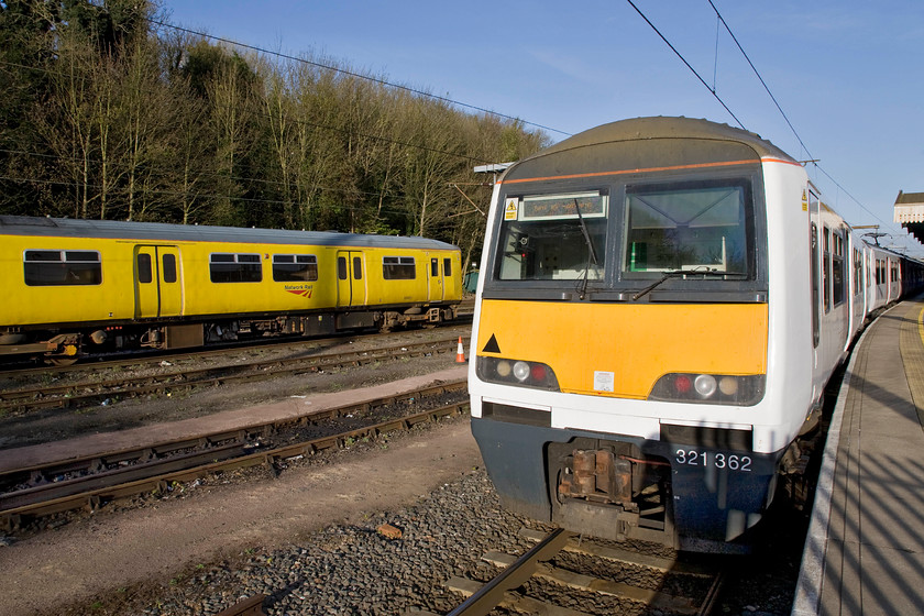 950001 & 321362, stabled, Ipswich station 
 Utilising the lens at its widest angle (24mm) Abellio Greater Anglia's 321362 waits on Ipswich's platform four to work its next service back to Liverpool Street. In the adjacent yard track recording unit 950001 will later perform duties on a number of the Essex branch lines. 
 Keywords: 950001 321362 stabled Ipswich station