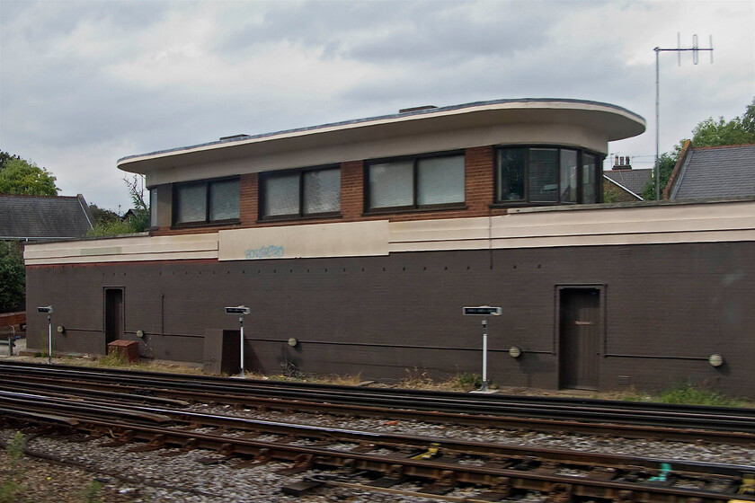 Richmond signal box (SR, 1940) 
 Richmond signal box is seen from the train window as we pass by. It is a Southern Railway Type 13 structure built in 1940. Since 1980 it has contained an NX panel (eNtrance-eXit) that now extends as far as Feltham, Acton Wells Junction and to the London Underground lines. Its future is a little uncertain as there are plans afoot to resignal this area. 
 Keywords: Richmond signal box