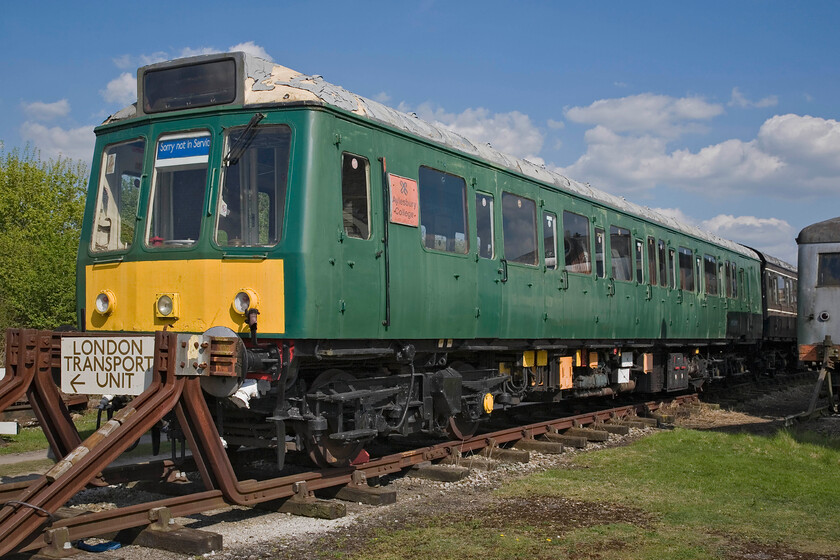 11. M51899, undergoing restoration, Quainton Road Up Yard 
 Derby built Class 115 51889 'Aylesbury College Silver Jubilee 1987' is seen in Quainton Road's up yard appearing to be undergoing restoration. This was the only Class 115 ever to be named with the plate now worn being a replica with the original version being presented to the college in March 1991. The complete three-car DMU set has been used extensively on the preserved line and is well known for operating the Quaintonian specials from Quainton Road to and from Aylesbury. 
 Keywords: M51899 undergoing restoration Quainton Road Up Yard Aylesbury College Silver Jubilee 1987 Class 115