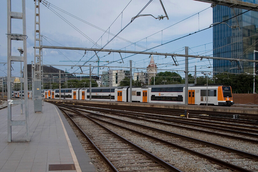 450 004, Rodalies unidentified working, Barcelona Frana station 
 An unidentified Rodalies suburban service enters Barcelona's Frana station worked by one of their fleet of Class 450s, 450004. Introduced in 1990, these high-density double-decker units are capable of carrying over a thousand seated passengers and a further eight hundred standing, not that I should imagine that this would be very pleasant! 
 Keywords: 450 004 Rodalies unidentified working Barcelona Frana station