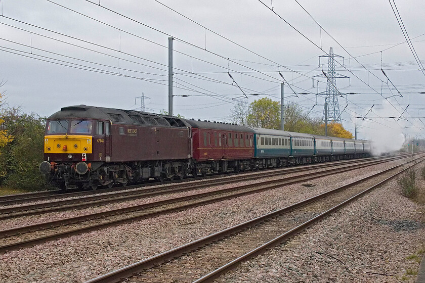 47848 & 44871, outward leg of The Christmas White Rose, 07.38 London King's Cross-York (1Z52, 2E), Tempsford level crossing 
 Offering little in the way of assistance WCR's 47848 brings up the rear of the outward Christmas White Rose charter running as 1Z52. Leaving King's Cross at 07.38 the charter would arrive at York just two minutes adrift at 12.19 giving passengers the afternoon to explore the opening weekend of the York Christmas Market. The exhaust at the front of the train is from Black 5 44871. 
 Keywords: 47848 44871 outward leg of The Christmas White Rose 07.38 London King's Cross-York 1Z52 Tempsford level crossing West Coast Railways