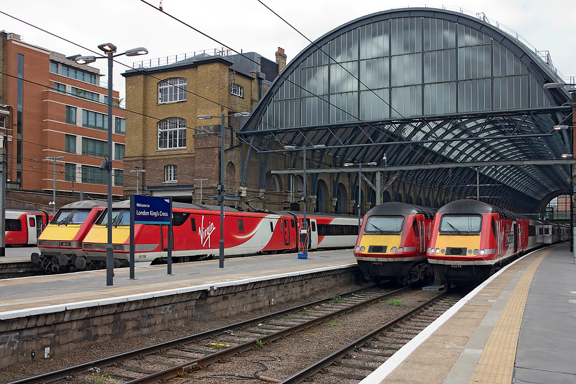 91103, GR 16.30 London Kings Cross-Edinburgh (1S25, RT), 91118, GR 16.33 London Kings Cross-Leeds (1D22, 20L), 43318, GR 07.55 Inverness-London Kings Cross (1E13, 1E) & 43274, GR 16.00 London Kings Cross-Aberdeen (1S24, 1E), London Kings Cross station 
 A sea of Virgin East Coast at London King's Cross! From left to right.....91103, 16.30 to Edinburgh (1S25), 91118, 16.33 to Leeds (1D22), 43318, 07.55 from Inverness (1E13) and 43274 'Spirit of Sunderland', 16.00 to Aberdeen (1S24). I like the style of the Virgin East Coast branding, it's smart and stylish and brings some brightness to the drabness of London King's Cross station. 
 Keywords: 91103 1S25 91118 1D22 43318 1E13 43274 1S24 London Kings Cross station