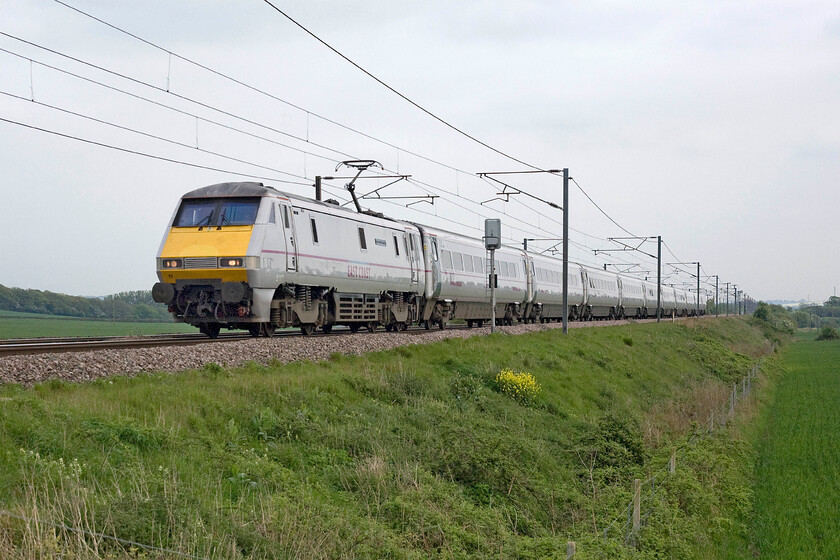 91117, GR 16.00 London King's Cross-Edinburgh Waverley (1S24), Frinkley Lane crossing SK906436 
 Named after the famous LNER titled train 91117 'West Riding Limited' powers past Frinkley Lane between Grantham and Newark leading the 16.00 King's Cross to Edinburgh East Coast service. After a disappointingly dull day there were signs to the west of a little brightness in the sky, perhaps the day would end with some sun? 
 Keywords: 91117 16.00 London King's Cross-Edinburgh Waverley (1S24), Frinkley Lane crossing SK906436 West Riding Limited