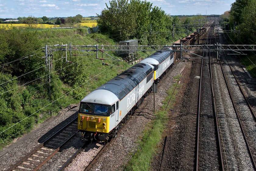 56103 & 56091, 14.35 Willesden DC Rail Sidings-Chaddesden Sidings (6Z56), Victoria bridge 
 Having worked up to Willesden earlier in the day, 56103 and 56091 return with their rather light load of nine empty wagons. The vintage DCR operated class 56s would hardly be tested too hard working this, the 14.35 Willesden DC sidings to Chaddesden (Derby) move. It's good to be able to observe these one-off workings on the busy WCML every now and then. 
 Keywords: 56103 56091 14.35 Willesden DC Rail Sidings-Chaddesden Sidings 6Z56 Victoria bridge