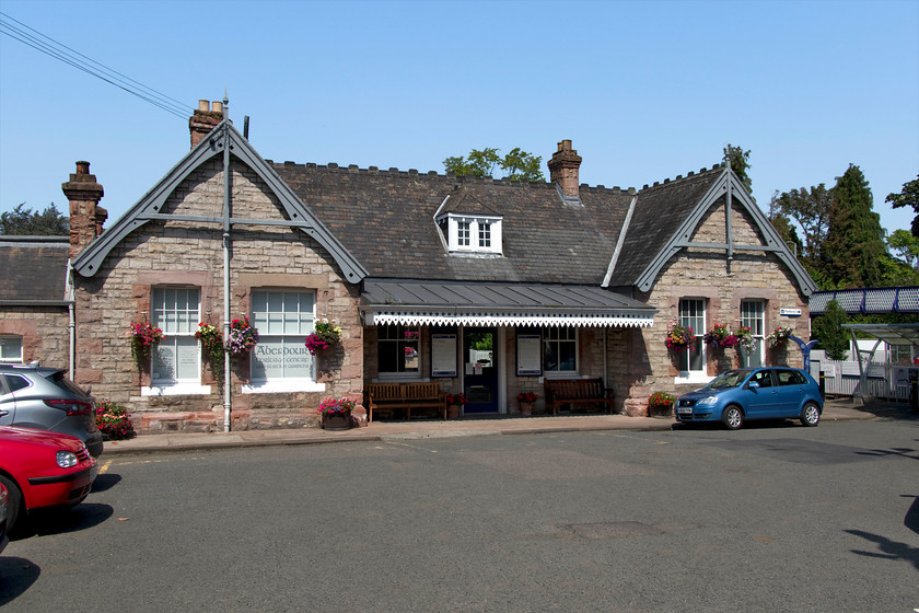 Frontage, Aberdour station 
 The lovely frontage of Aberdour station is adorned with hanging baskets and maintained in lovely condition. As is usual, various parts of the station have been put to other uses such housing a local heritage centre. The station has an active friends group who undertake the work to maintain it to a high standard with their efforts having paid off, see... https://www.bbc.co.uk/news/uk-scotland-edinburgh-east-fife-45527857 
 Keywords: Frontage Aberdour station