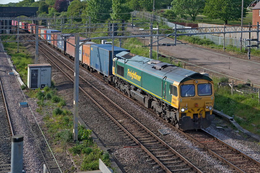 66616, 12.16 Lawley Street-London Gateway (4L46, 141L) site of Roade station 
 Freight number 4 (17.55) -

It is unusual for a 66/6 to work an intermodal but here 66616 passes Roade leading the heavily delayed 4L46 12.16 Lawley Street to London Gateway and it has gone through quite a logistical exercise in order to do this. Earlier in the afternoon, 66415 failed near Long Buckby hauling the 4M94 07.50 Felixstowe to Lawley Street. 66605 was removed from the 4L46 that was stopped at Rugby and sent south wrong line to rescue 4L46 and take it onwards to Birmingham. That left an engineless 4L46 at Rugby so 66616 was removed from the 6H50 13.17 Willesden to Crewe Basford Hall abandoning its train on the Bletchley relief lines. It headed north to Rugby as 0Z99 and was attached to 4L46 that is seen passing through Roade in this photograph well over two hours late. 
 Keywords: 66616 12.16 Lawley Street-London Gateway 4L46 site of Roade station Freightliner