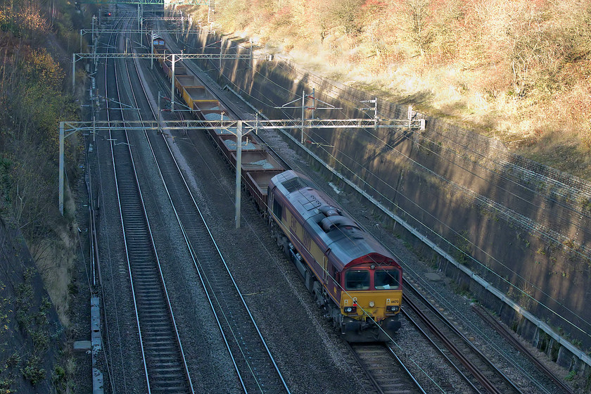 66170 & 66167, 12.20 London Euston-Bescot Downside, Roade Cutting 
 Dead in tow, 66170 is dragged along at the back of the 12.20 Euston to Bescot Downside engineer's working being led by 66170. I had been tracking the progress of this working on RTT since it left London with its rake of partially loaded MHA wagons returning after overnight work in Euston station. 
 Keywords: 66170 66167 12.20 London Euston-Bescot Downside Roade Cutting